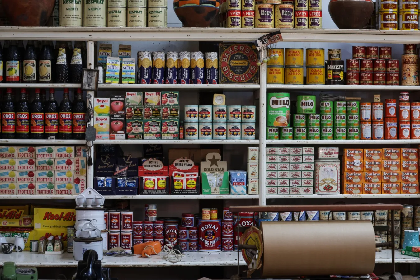 A vintage grocery store shelf filled with retro products and packaging from various brands