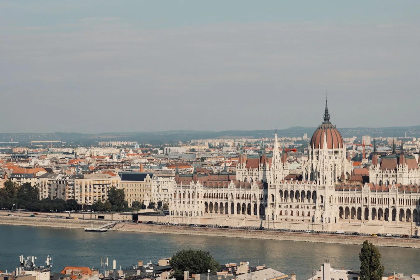 Scenic view of the iconic Hungarian Parliament Building along the Danube River in Budapest